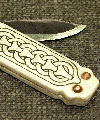 Copy of a double bladed folding bone handled knife. Size: approx. 120mm diameter